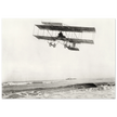 Vintage aircraft M. Van den Born flying above the sea Old photograph reproduction.