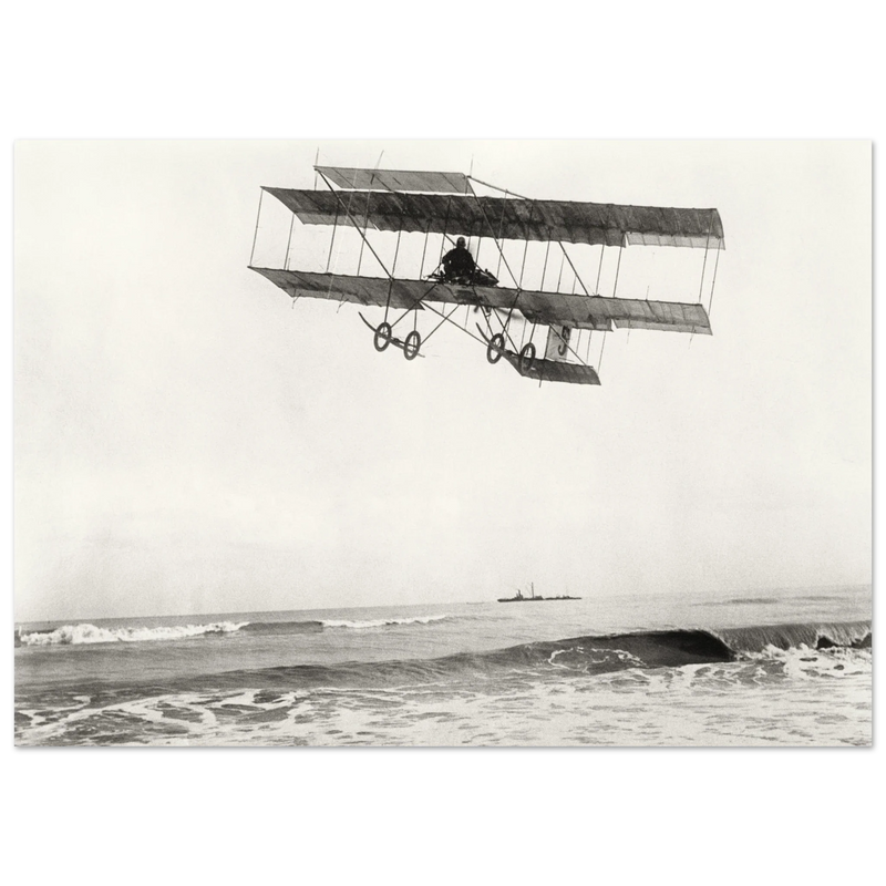 Vintage aircraft M. Van den Born flying above the sea Old photograph reproduction.