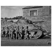 World war 2 black and white photograph. tank and american soldiers advancing in Belgium