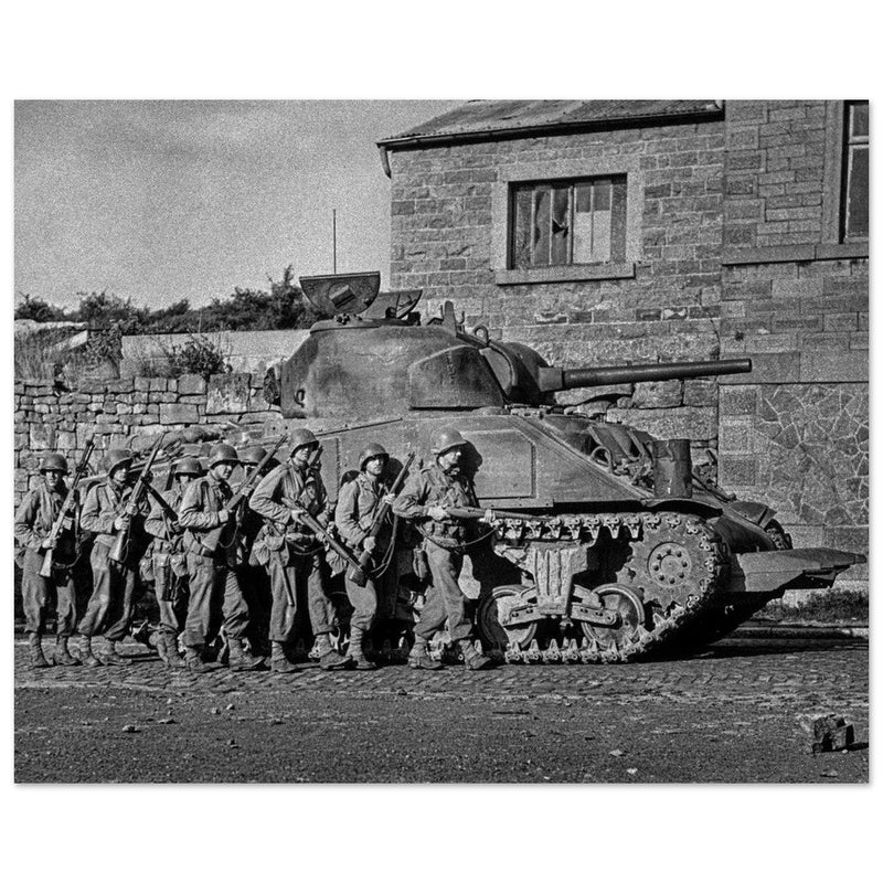 World war 2 black and white photograph. tank and american soldiers advancing in Belgium