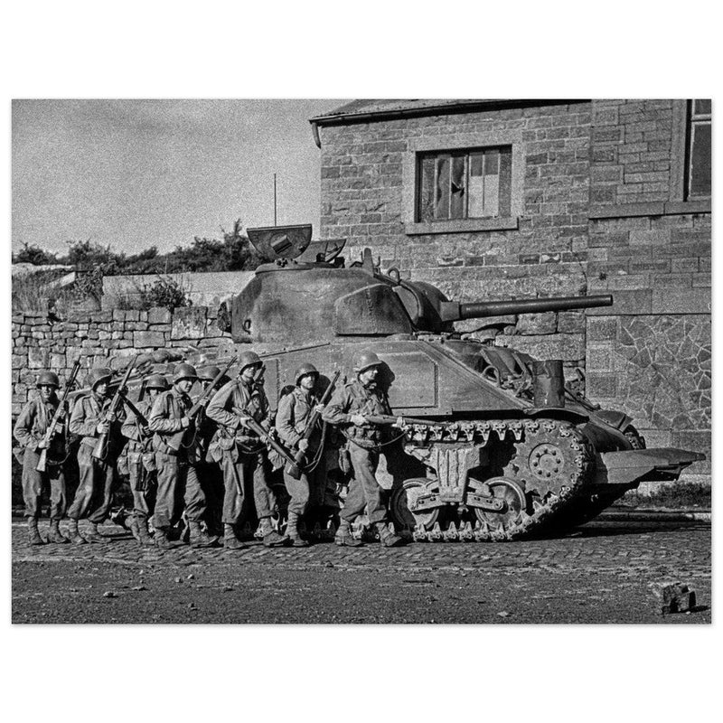 World war 2 black and white photograph. tank and american soldiers advancing in Belgium